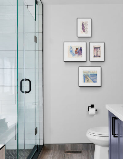 art prints in black frames in bathroom with purple counter archival limited edition singed ink and watercolor wall art