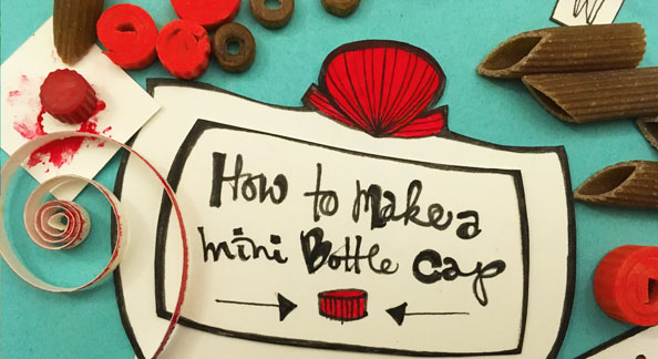A still frame from a stop motion video showing how to make a mini bottle cap prop from penne pasta by Kathryn Ann Jankowski