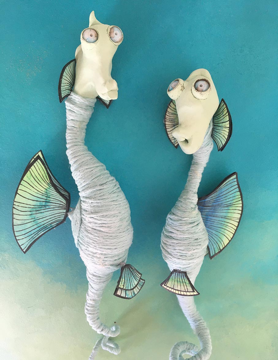 Seahorse couple characters blue body blue green and yellow fins